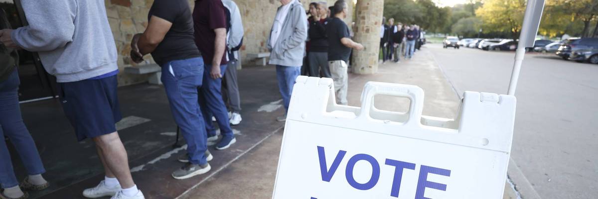 People stand in line outside Elzie Odom Athletic Center in Arlington, Texas