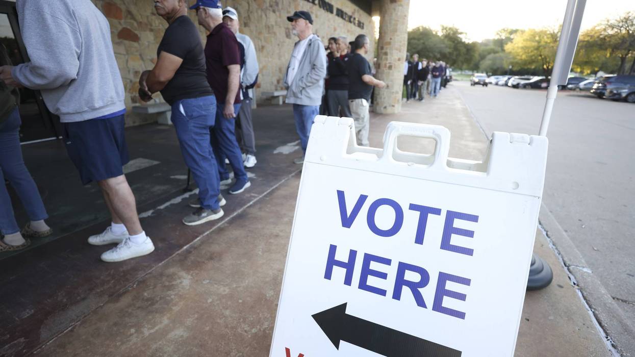 People stand in line outside Elzie Odom Athletic Center in Arlington, Texas