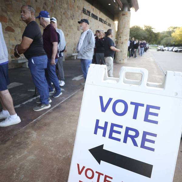 People stand in line outside Elzie Odom Athletic Center in Arlington, Texas