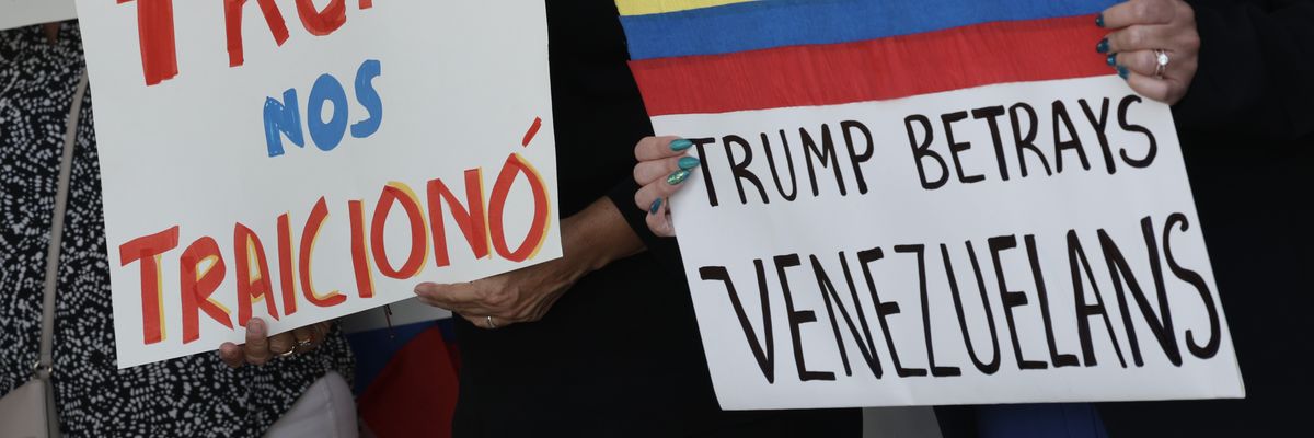 People stand together to support a resolution in favor of reinstating temporary protected status for Venezuelans on February 13, 2025