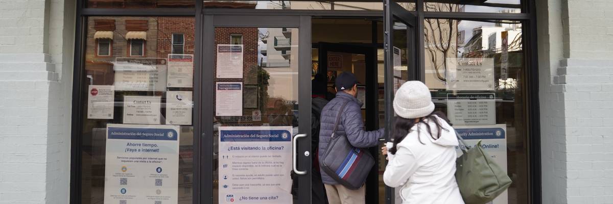 People step into an office of the Social Security Administration