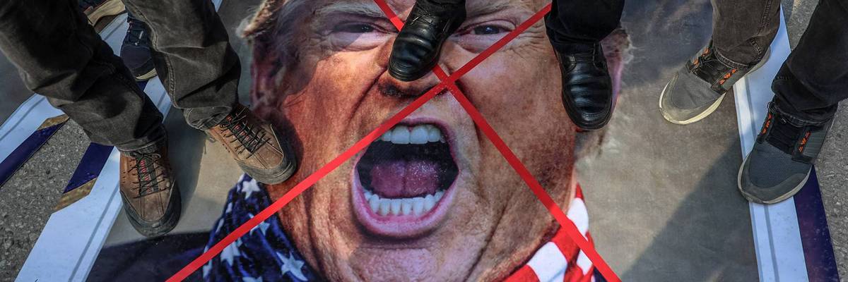 People step on Trump photo.
