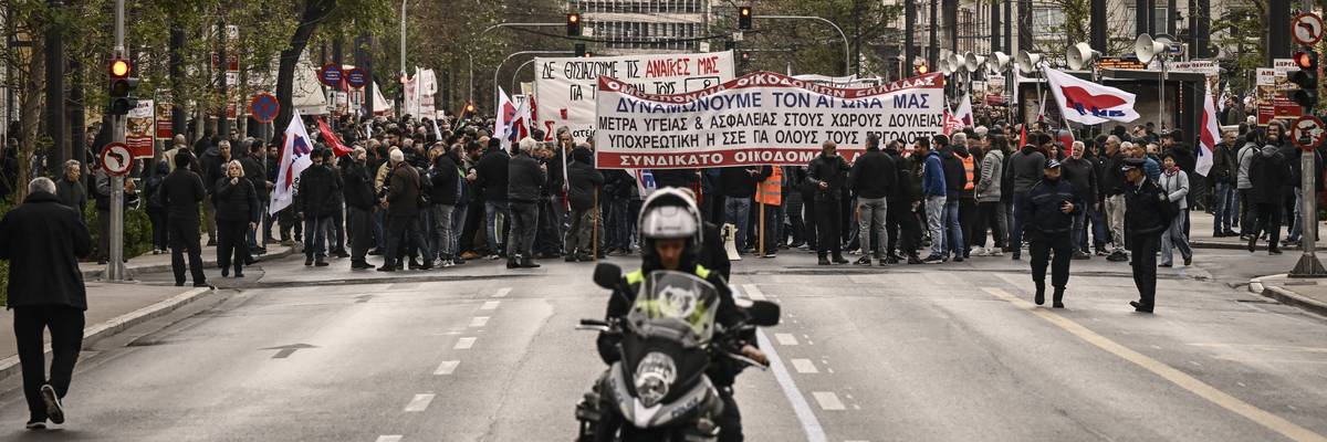 People take part in a demonstration of labor unions during a 24-hour general strike over austerity measures