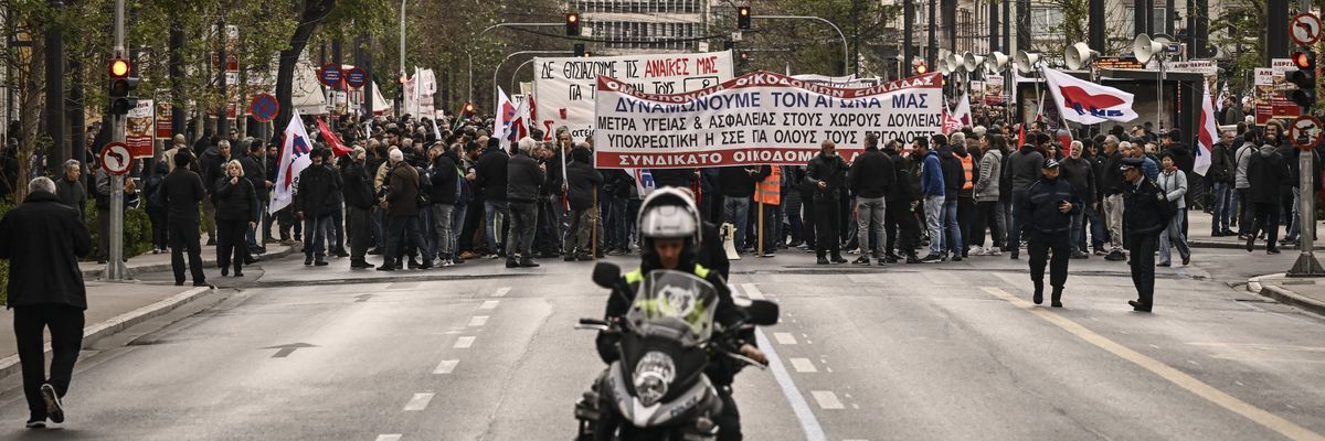 People take part in a demonstration of labor unions during a 24-hour general strike over austerity measures