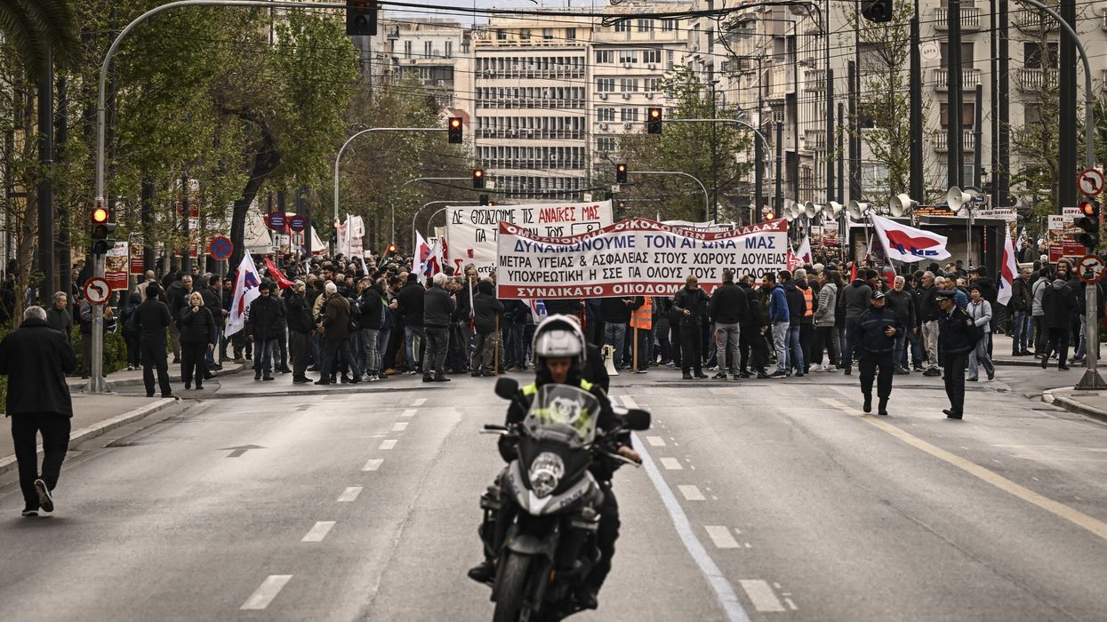 People take part in a demonstration of labor unions during a 24-hour general strike over austerity measures