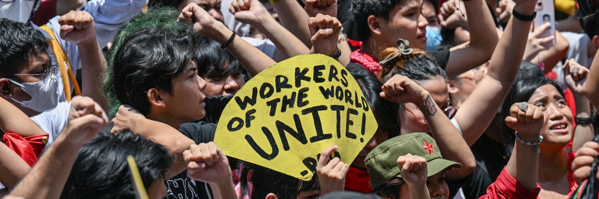People take part in a May Day demonstration in Manila