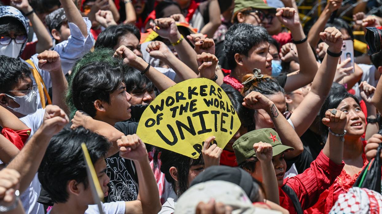 People take part in a May Day demonstration in Manila