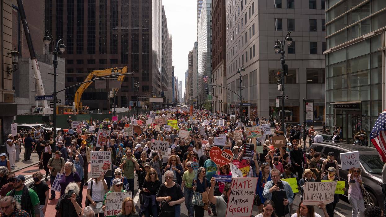 People take part in a protest against President Donald Trump's policies