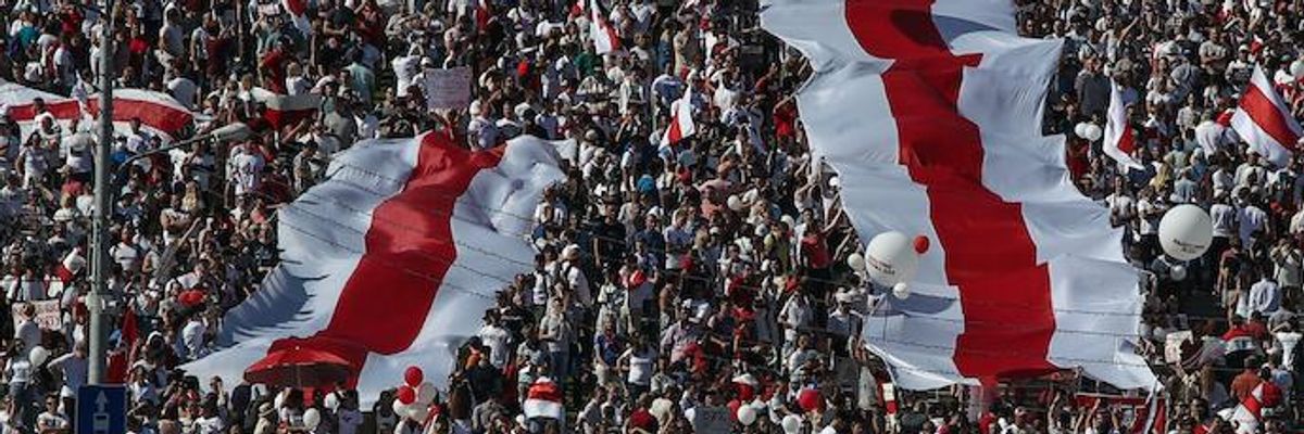 People take part in a protest against the 2020 Belarusian presidential election results by the Minsk Hero City Obelisk.