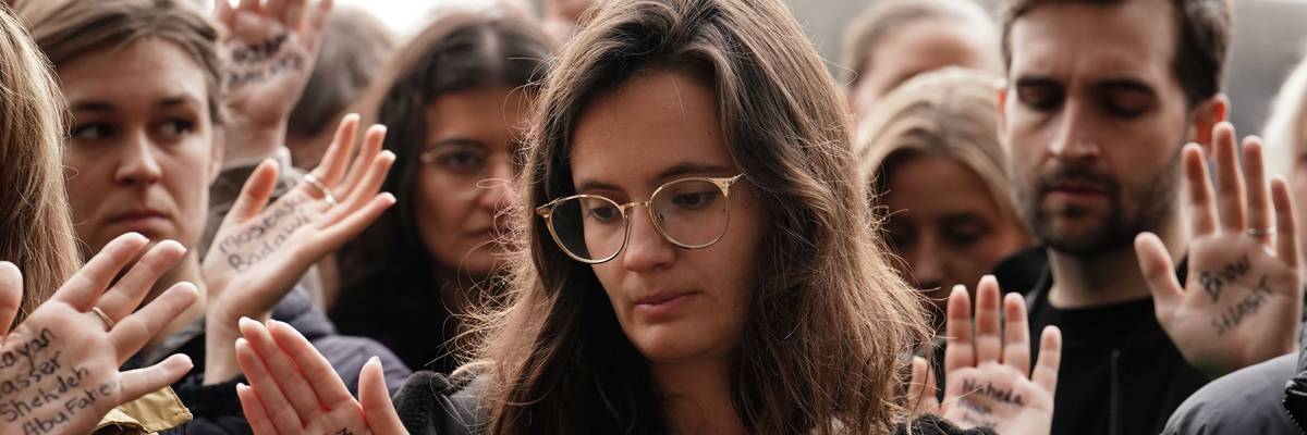 People take part in a vigil