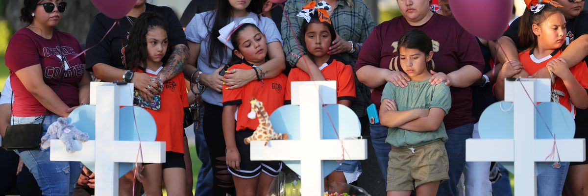 People visit memorials for victims of a mass shooting in Uvalde, Texas.