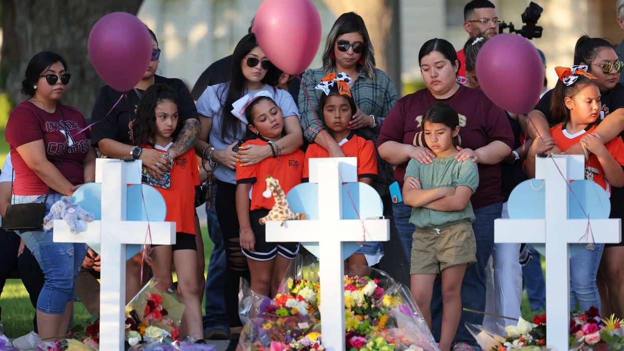 People visit memorials for victims of a mass shooting in Uvalde, Texas.