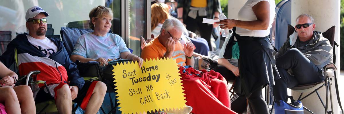 People Wait In Line To File For Unemployment Benefits In Frankfort, Kentucky