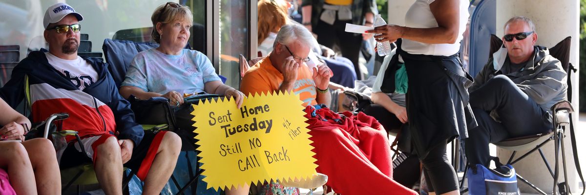 People Wait In Line To File For Unemployment Benefits In Frankfort, Kentucky
