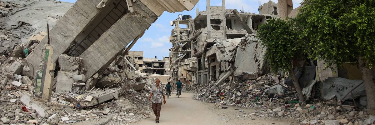 People walk amid rubble in Gaza.