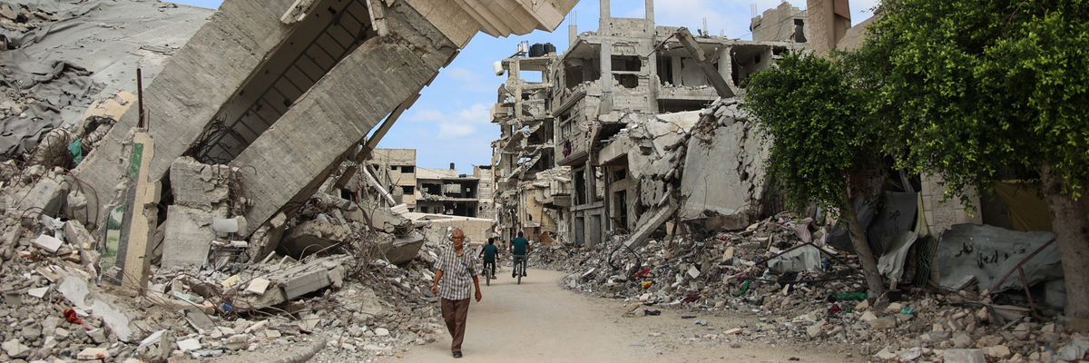 People walk amid rubble in Gaza.