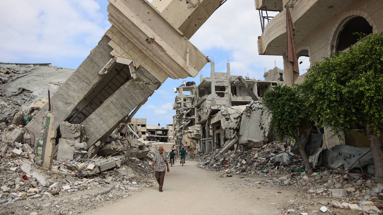 People walk amid rubble in Gaza.