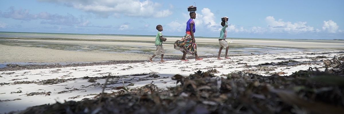 People walk in Mozambique.