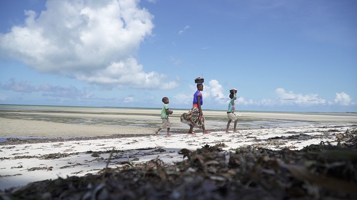 People walk in Mozambique.