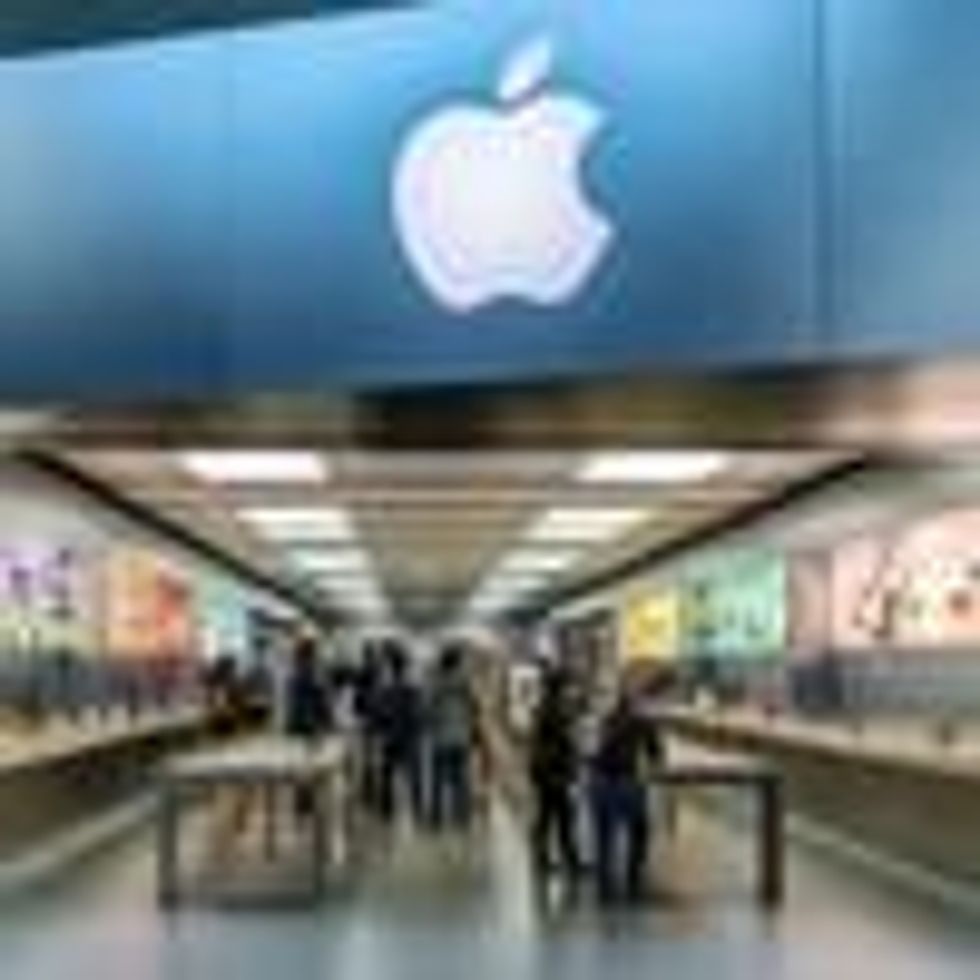 People walk through an Apple retail store in Buford, Georgia on March 28, 2019.