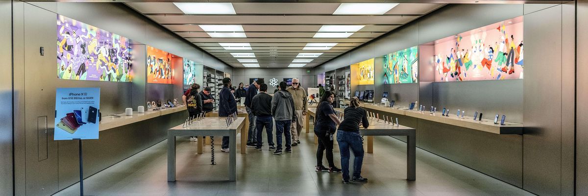 People walk through an Apple retail store in Buford, Georgia on March 28, 2019.