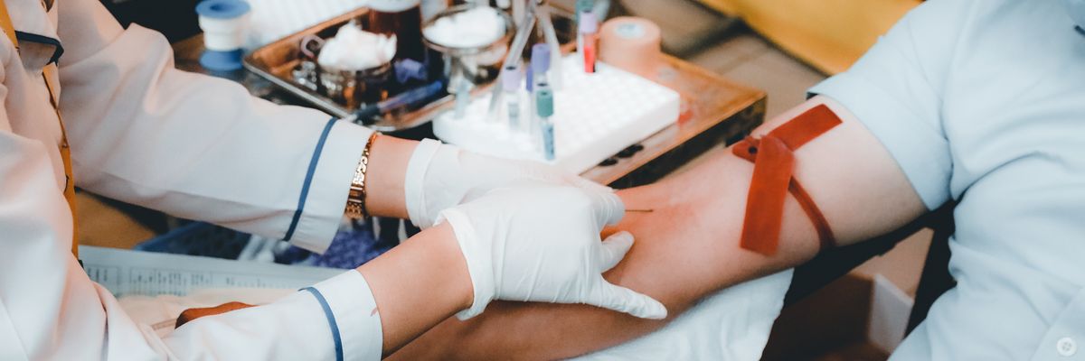 Person having blood drawn.