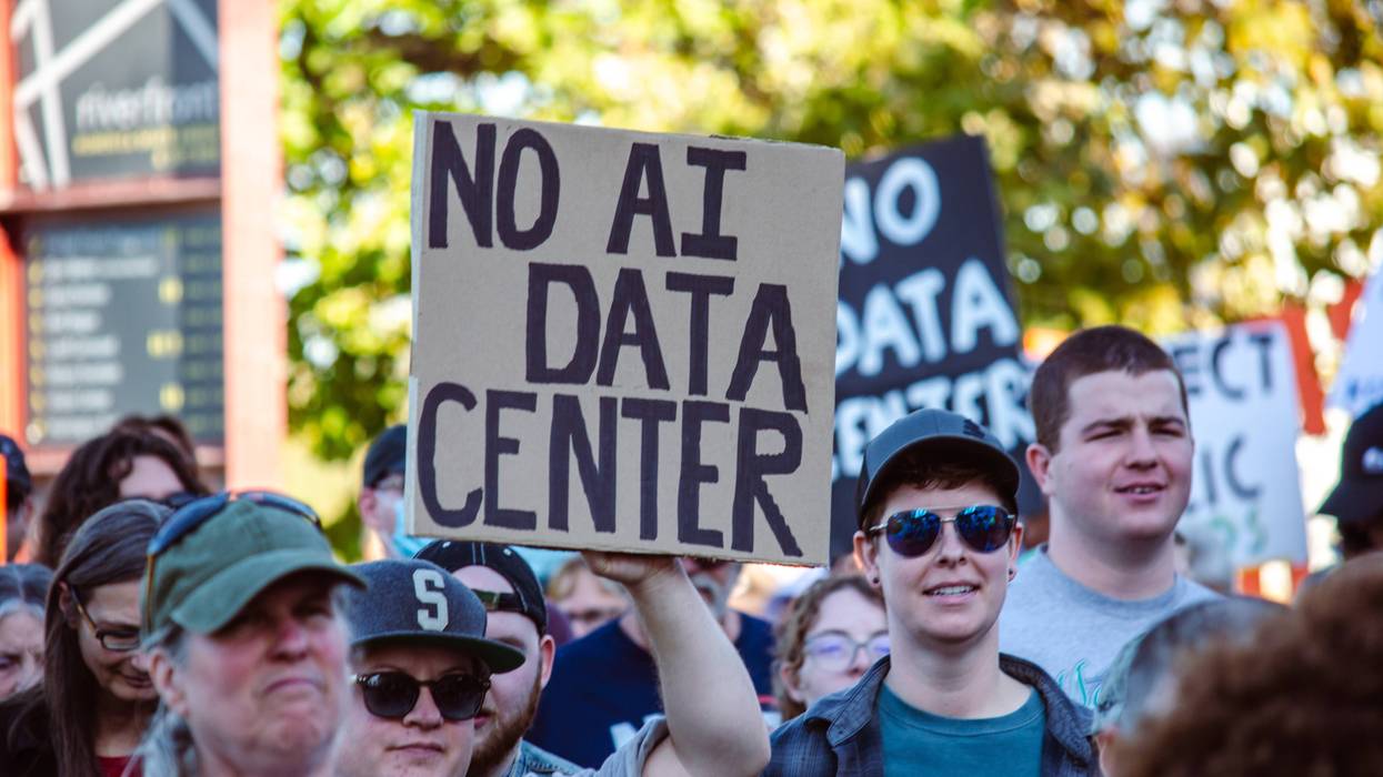 Person holds sign reading, "No AI data center."