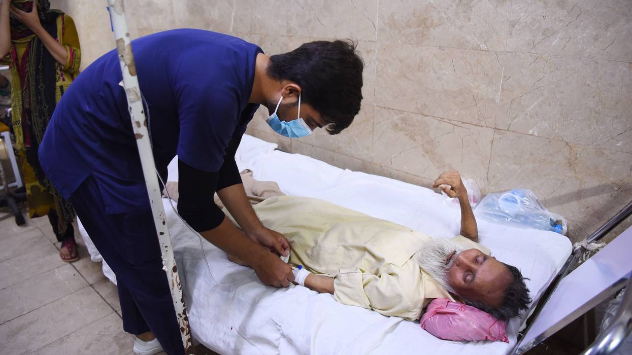 Person receives treatment during heatwave.