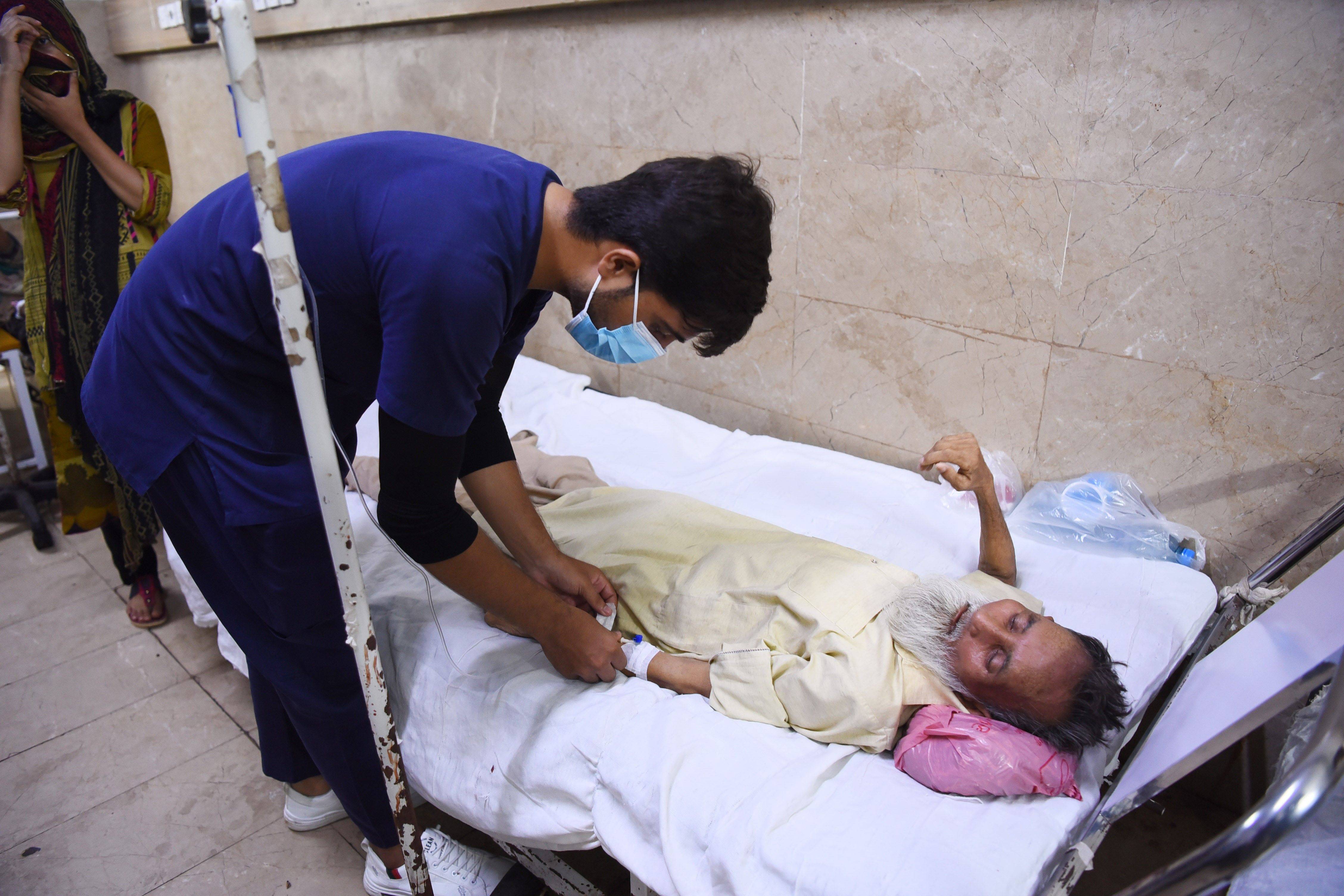 Person receives treatment during heatwave.