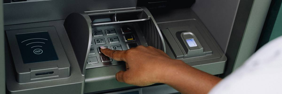 Person using ATM.