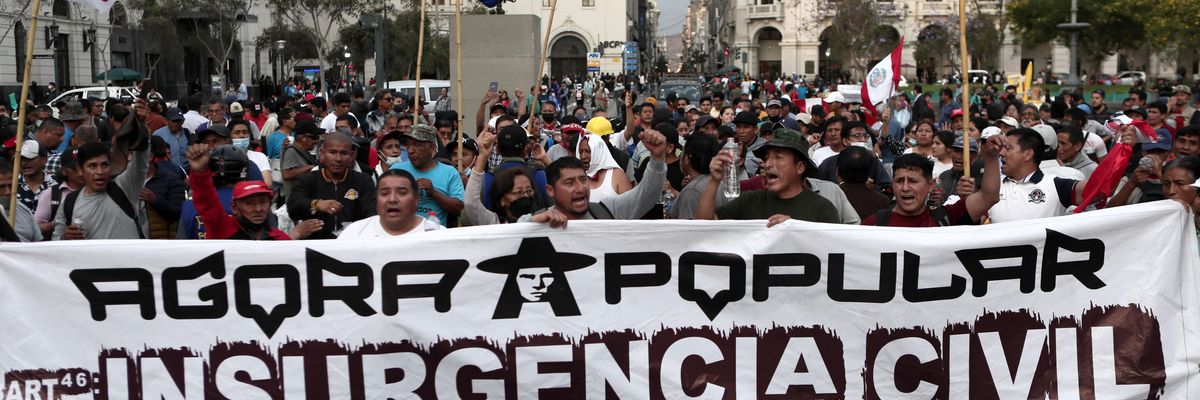 Peruvians gather in Lima on December 14, 2022 to demand the resignation of unelected interim President Dina Boluarte, the dissolution of Congress, fresh elections, a new constitution, and the release of ousted President Pedro Castillo, who has been detained since right-wing lawmakers removed him from office last week.