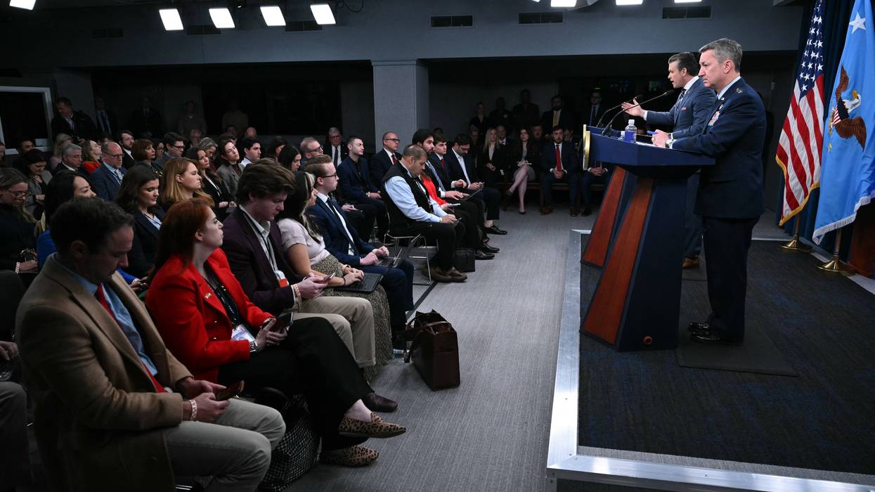 Pete Hegseth and Dan Caine at a press conference.
