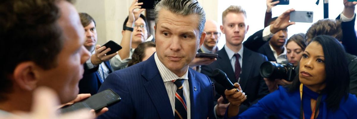 Pete Hegseth speaks to reporters.