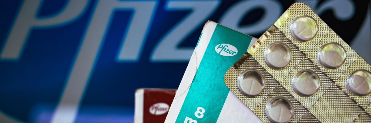 Pfizer logo with pills