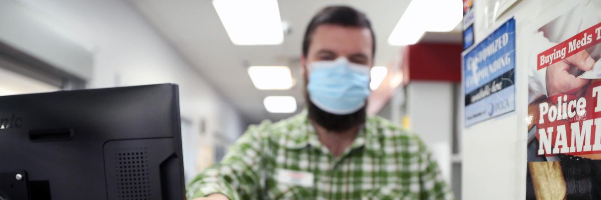 Pharmacist holding a Covid-19 test