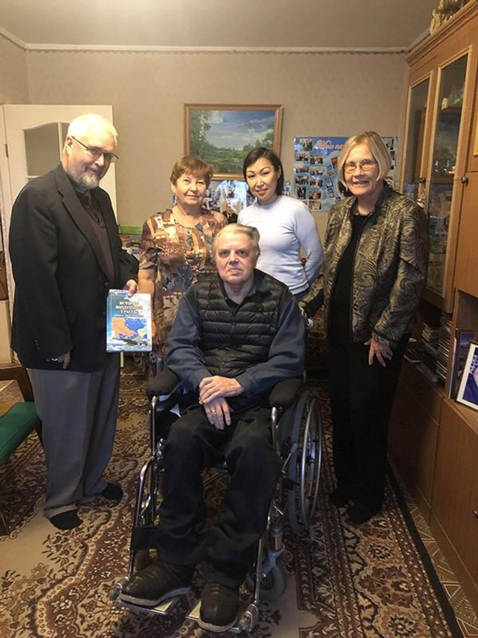 Photo by Ann Wright.  Author in center, Ivan Efimovich Negenblys; Left to right- Rotarian and host Pete Clark, researcher and Ivan's wife Galina; host and Rotarian Katya Allekseeva; Ann Wright