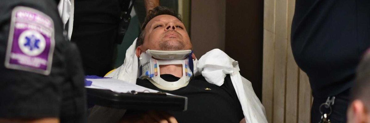 Journalist Taken Out of Courthouse in Stretcher After Shove From Masked ICE Agent