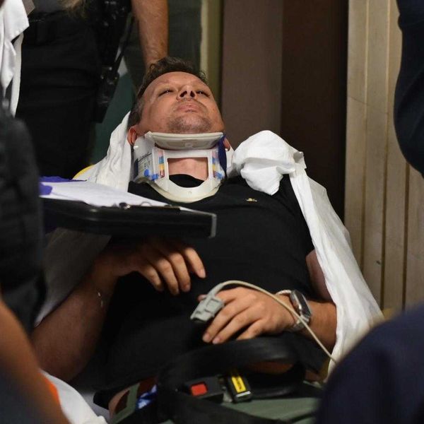 Journalist Taken Out of Courthouse in Stretcher After Shove From Masked ICE Agent