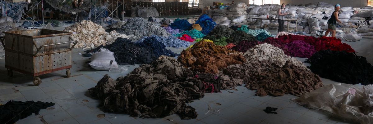 Piles of cloth sorted by color.