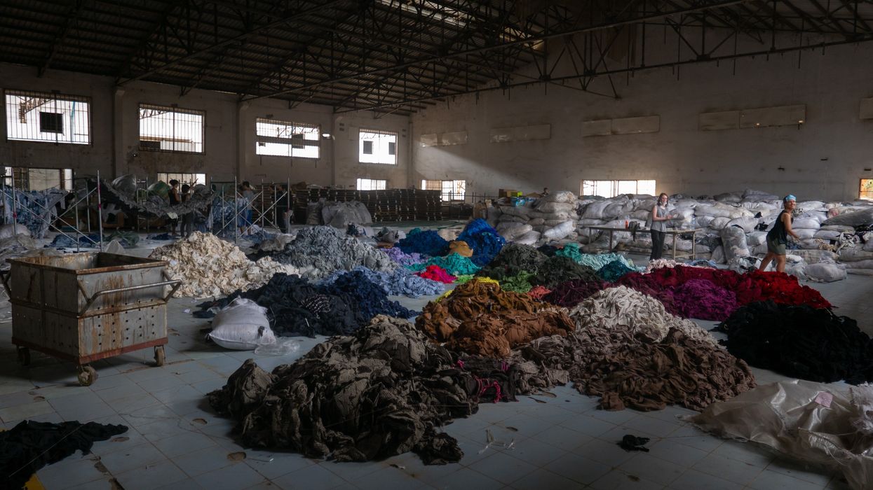 Piles of cloth sorted by color.