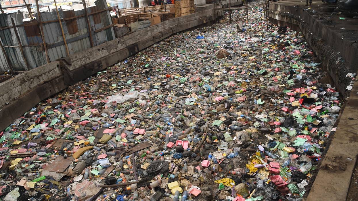 Plastic waste floats in a canal in Lagos.