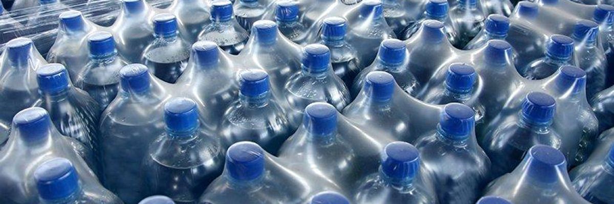 Plastic water bottles stored in plastic film. 