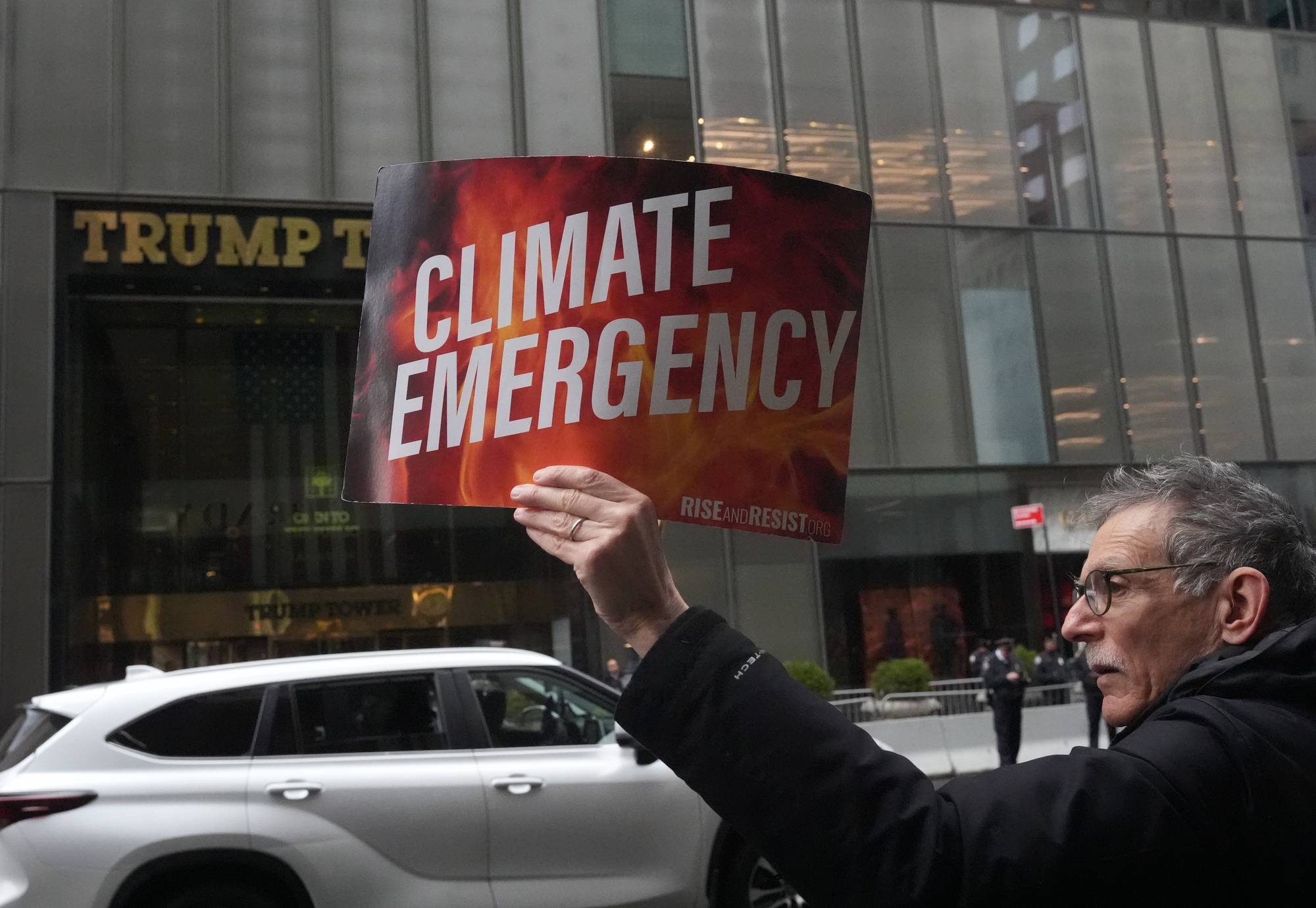 Police arrest activists who block traffic on 5th Ave during the Earth Day Protest outside Trump Tower