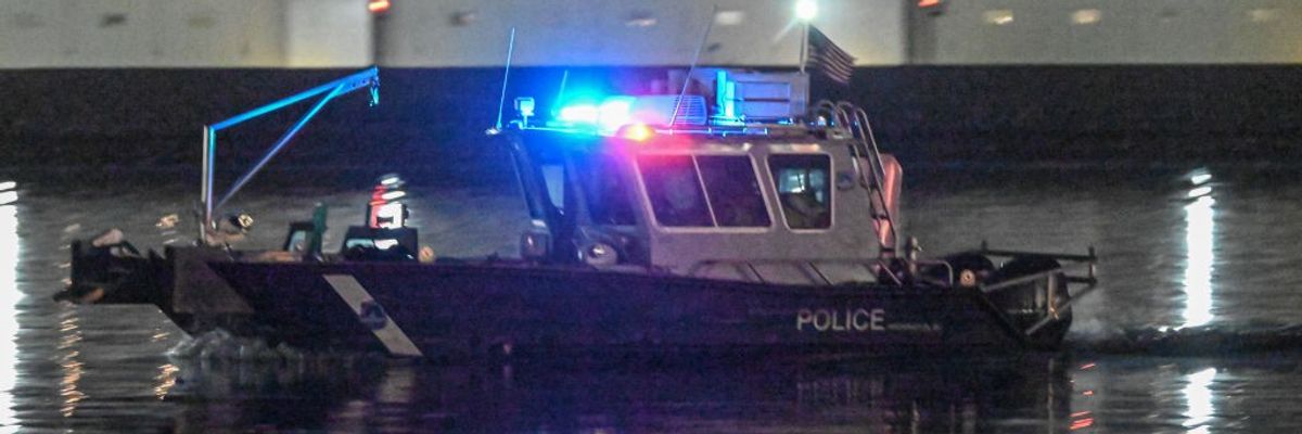 Police boat patrols aircraft helicopter crash scene in Washington DC