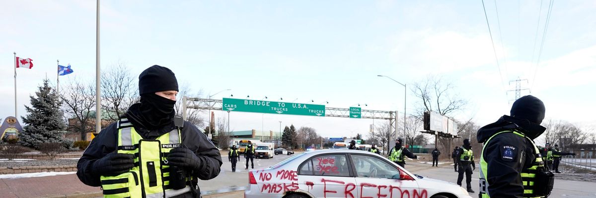 Police clear demonstrators near the US border