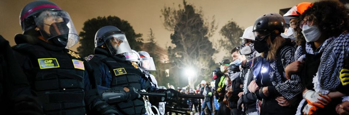 Police face off with students.