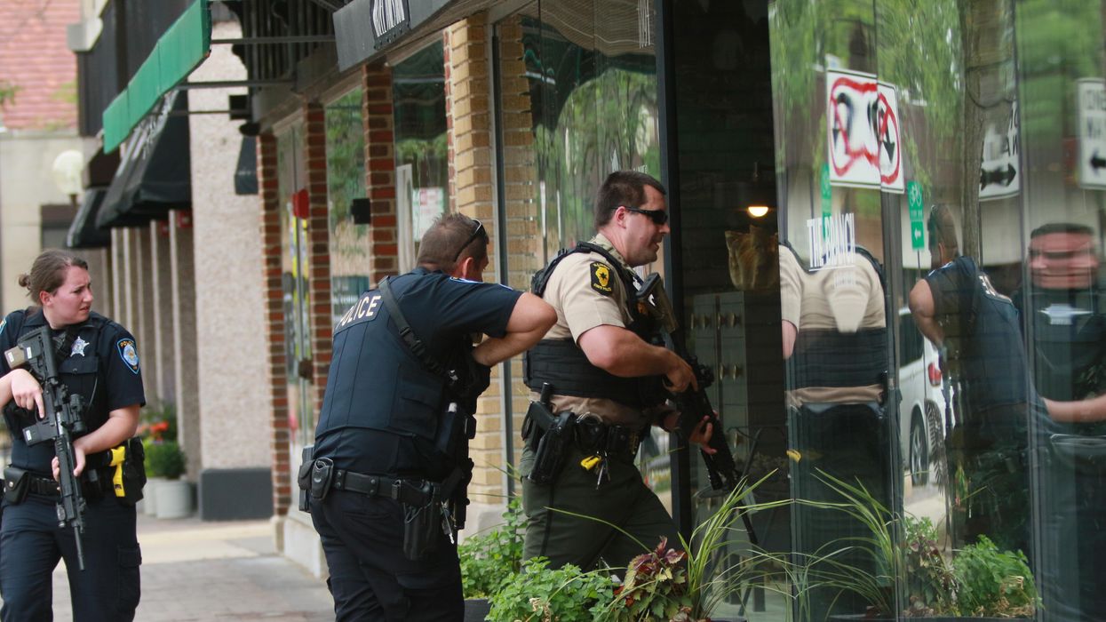Police in Highland Park, Illinois search for a gunman after a mass shooting on July 4th, 2022.