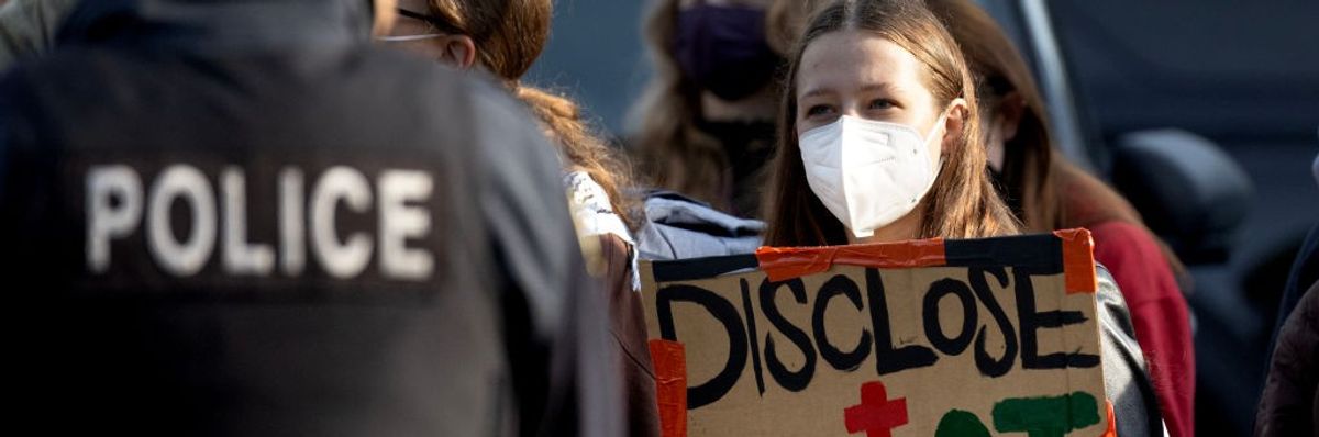 Police keep activists back as workers remove a pro-Palestinian encampment