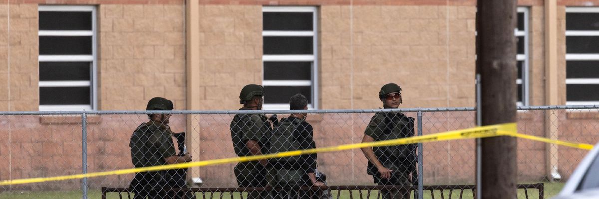 Police officers are pictured at Robb Elementary School