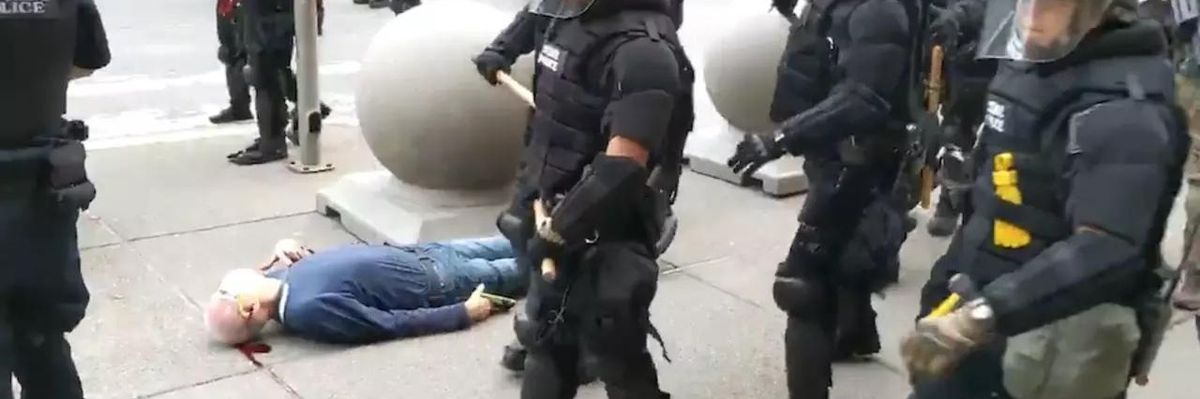 Police officers in Buffalo, New York walk by the motionless body of 75-year-old Martin Gugino as he bleeds from his ear after being attacked by officers during a protest on June 5, 2020. (Photo: Screengrab/WBFO)